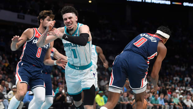 Charlotte Hornets guard LaMelo Ball (1) looses the ball to Washington Wizards guard Bilal Coulibaly (0) during the first half at the Spectrum Center. 